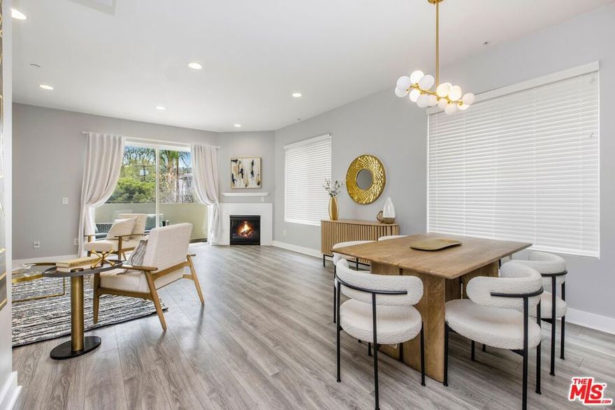 Spectacular 3BD/3.5BA townhome south of the Boulevard in Studio City! This beautifully maintained, move-in ready home features soaring ceilings and an abundance of natural light throughout. The chef's kitchen is a dream, boasting granite countertops, stainless steel appliances, and a spacious walk-in pantry. The inviting living room includes a cozy fireplace and opens to one of three private patios, perfect for indoor-outdoor living. Upstairs, the expansive primary suite offers a spa-like bath, a large walk-in closet, and access to a second private patio. Also on this level: a second bedroom with its own full bath, plus a convenient in-unit laundry area. The top floor features a third bedroom with an en-suite bath and a private patio with breathtaking views of the hills. Additional highlights include two side-by-side parking spaces, a private storage unit in the garage, guest parking, a community patio with BBQ, a recreation room with gym equipment, and dedicated bike/stroller storage. Just moments from all the shopping and dining along Ventura Boulevard and located within the coveted Carpenter Elementary School district, this one won't last!