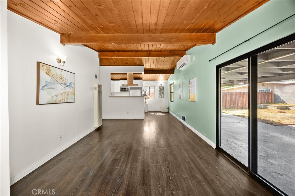 This beautiful single-family home offers 3 bedrooms and 2 bathrooms with a desirable north-south orientation, nestled in a peaceful Azusa neighborhood.
Upon entry, a handy storage closet welcomes you into the bright living space. The home features a comfortable living room that flows into a remodeled kitchen, equipped with ample cabinetry, quartz countertops, a range hood, and a cozy dining area. Sliding glass doors from the living room open to the backyard, seamlessly blending indoor and outdoor living. Beautiful wooden ceilings, newer flooring, and central heating enhance the interior comfort, while separate air conditioning units in each bedroom provide personalized climate control and energy savings.
The bedroom arrangement includes a primary suite and two additional bedrooms, served by a well-appointed shared bathroom.
Outside, a concrete driveway leads to a spacious two-car garage, complete with a laundry area and a versatile workbench—ideal for projects and storage. The expansive backyard is perfect for entertaining, featuring a large covered patio for relaxing or hosting gatherings, a fire pit area, a square of lawn, a water feature, and low-maintenance concrete paving that extends through the side yard.
Conveniently located near schools, Azusa Pacific University, the Citrus Crossing shopping center, and the 210 freeway, this property offers both tranquility and easy commuter access. Claim this move-in-ready home as your own!