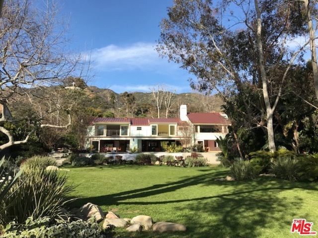 Located on a quiet cul-de-sac in one of Malibu's most prestigious neighborhoods, famed & guard gated Serra Retreat near Malibu's Pier, epic surf, boutiques and restaurants & horse riding trails. "Unvarnished"modern designed home by Scott Gillen on one of the most breathtaking lots you will ever see by world renowned landscape architect Jay Griffith w/ infinity pool & Baja shelf, fire-pit & outdoor BBQ area. Chef's dream kitchen, Tv room w/vaulted ceilings & massive, picturesque windows that frame beautiful gardens and mountain views. Leading upstairs via the floating steel and oak staircase, up to over-sized bedroom suites, each include siting areas & spa bathrooms with frameless glass shower enclosures. Massive master suite w/ breathtaking views of the yard, trees and creek. New metal roof and other significant features of the home included.