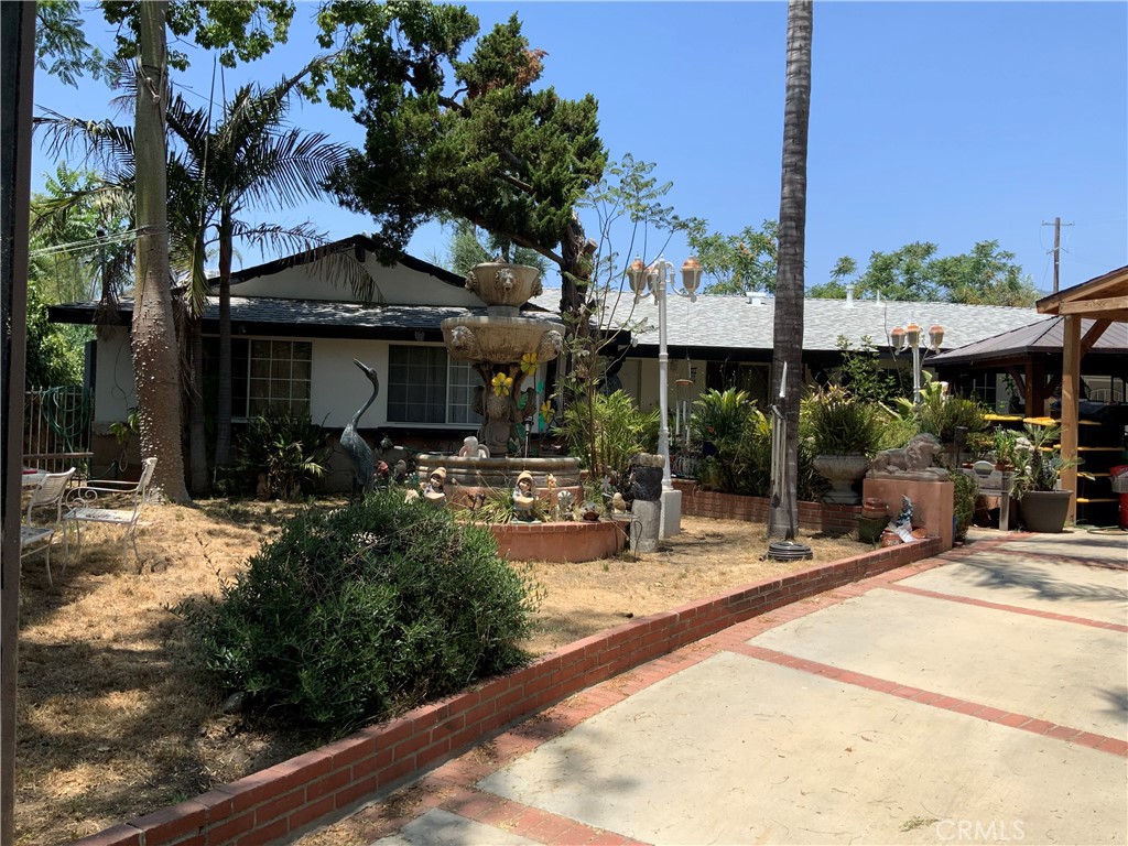 Incredible opportunity to own a spacious gated property in the heart of Sylmar! This beautifully maintained 3-bedroom, 2-bathroom home offers an expansive 2,804 square feet of living space on a massive 21,868 square foot lot. With plenty of room to expand, add an ADU, or create your dream outdoor retreat, the possibilities are endless. Inside, you'll find generously sized living areas, a functional layout, and abundant natural light throughout. The gated entry provides added privacy and security, while the oversized lot offers ample space for parking, entertaining, or future development. Conveniently located near schools, parks, and major freeways, this property is ideal for those seeking space, comfort, and long-term potential in a desirable Sylmar neighborhood.