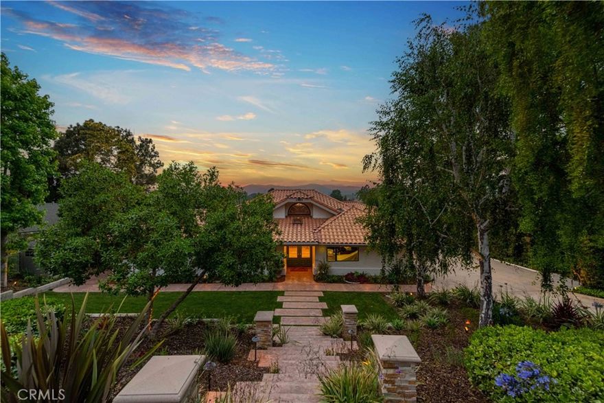 Welcome to this exquisite custom single-story home located in one of the most sought-after areas in all of Southern California. The stage has been set for this rare Las Posas Estate (Camarillo CA) property that spans roughly 3100 Sq.Ft of comfortable living space and boasts some of the most MAJESTIC PANORAMIC VIEWS in all of Ventura County. This awe-inspiring property offers a dash of romantic warmth, and a touch of voguish elegance that can be found nowhere else on the market. Every inch of this stylish home has been updated with the highest quality custom upgrades. Its light & bright interior is a true toast to modern living. Its interior features include:travertine stone tile flooring, new high-end wood flooring, wide hotel-style hallways, new interior & exterior paint, luxury Pella windows & doors, a stunning formal living room, w/vaulted beamed ceilings, custom fireplace, &  incredible floor-ceiling picturesque windows w/180-degree views of the Las Posas golf course, rolling hills, and the Topa Topa mountains. Its gourmet, chef's kitchen, offers custom cabinetry, a large center island, w/granite countertops, custom backsplash, a coffee bar, extensive cocktail service bar, GE Monogram appliances, a large walk-in pantry. Also offering a remodeled powder room w/designer style wallpaper, spacious guest bedroom/office, an over-sized secondary guest bedroom, remodeled guest bathroom, upstairs loft w/winding staircase (optional 4th bedroom/office), and a large primary suite w/his & her closets, sliding glass doors, and a fully remodeled master bathroom. The exterior grounds are truly an entertainer's delight and only enhance this property's natural beauty. With complete privacy, this spectacular lot boasts a multi-level custom (weatherproof) Trex deck that has panoramic views of every vista, new mature landscaping throughout, a romantic built-in spa w/views, multiple patio/lounge areas, a custom-built staircase, new exterior lighting, a long private driveway w/large 3 car-attached garage w/built-in storage, new drywall, and so much more. Its gated lower-level tier offers multiple fruit trees, a large storage shed, golf cart parking space (under patio deck) and incredible possibilities to expand. Walking distance to the popular yet private Las Posas Country Club, this truly remarkable home is truly what luxury living is all about.