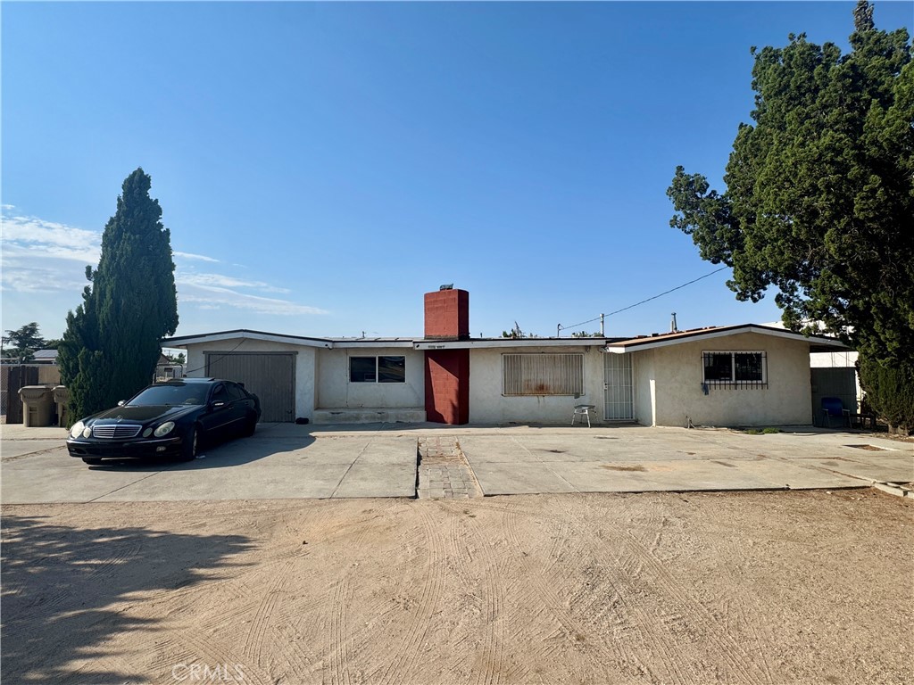 Single family home sitting on Main St in Hesperia close to the corner of Main and Maple. This 2 bedroom 1 bath home is zoned residential but offers many additional potential benefits with its large, open back yard to park vehicles or act as storage. The entire back of the property is fenced and is accessible on the side of the home through a gate. Buyer may have an opportunity to change the zoning to commercial use, but will want to verify with the city of Hesperia. This home and property offers quick access to shopping as well as the 15 freeway.