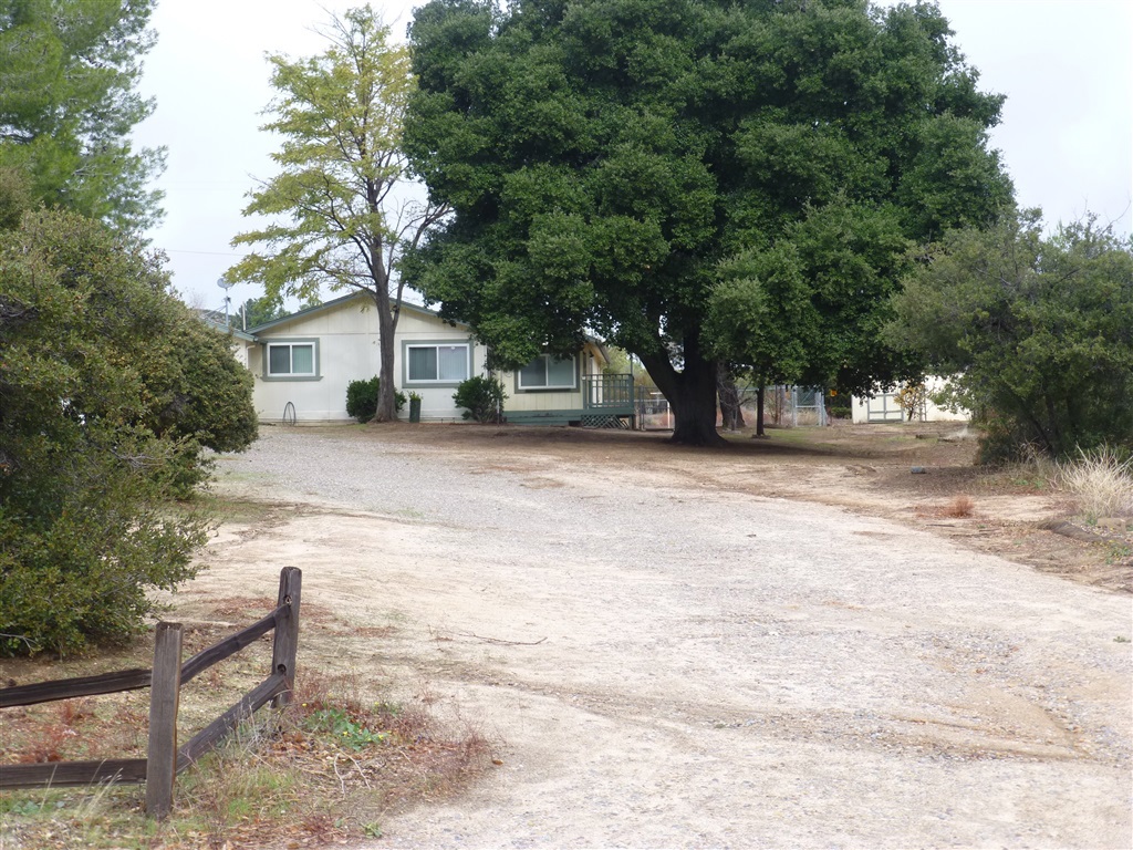 Enjoy the peacefulness of this wonderful country home in beautiful surroundings. 3 bedrooms, 2 full bathrooms, 1704 sf all 1 level. Large living room with fireplace, Master bedroom with full bath and walk in closet, Spacious laundry room & pantry. Vaulted ceilings & contemporary floor plan built in 1991, Attached 2 car garage. Take in the natural beauty form your spacious deck under the giant oak tree. All information believed to be accurate but not guaranteed. Manufactured home built on 1991. Buyer & Agent to verify all MLS information prior to inspection contingency removal including inspections, measurements, square feet, permits, Gas/Elec at Laundry, school district, and parking. Manufactured home on permanent foundation.. Neighborhoods: Campo Equipment: Dryer,Garage Door Opener, Washer Other Fees: 0 Sewer: Septic Installed Topography: LL,