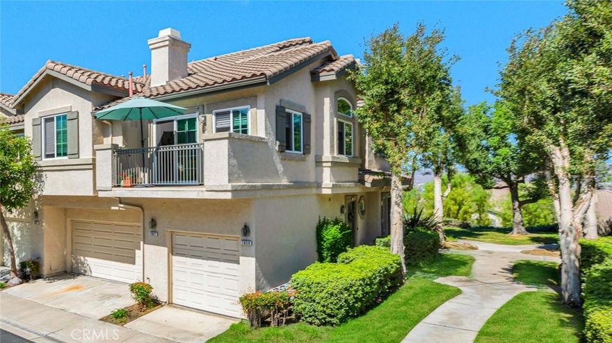 Beautifully Updated Carriage-Style Home in Gated Viewpointe North. Welcome to this spacious 2-bedroom, 2-bath home in the desirable Viewpointe North community! With no one above or below, this carriage-style residence offers privacy, comfort, and a bright open layout with vaulted ceilings and abundant natural light.  The remodeled kitchen with stainless steel appliances flows seamlessly into the dining and living areas, complete with recessed lighting, wood flooring, cozy fireplace, and a private balcony surrounded by trees—perfect for a relaxing “treehouse” feel.  The primary suite features a double-door entry, vaulted ceilings, two mirrored closets, and an updated bathroom with dual-sink vanity, private toilet area, and remodeled walk-in shower. The secondary bedroom is generously sized and served by a full guest bath with tub/shower combo. A convenient indoor laundry closet, direct-access garage plus designated covered carport, and thoughtful upgrades add everyday ease.  Viewpointe North offers resort-style amenities including multiple pools, five spas, clubhouse, and beautifully maintained grounds. Ideally located on a single-loaded street and within walking distance to Canyon Rim Elementary, hiking trails, Anaheim Hills Reservoir, and local parks, this home combines the best of privacy, convenience, and community living.