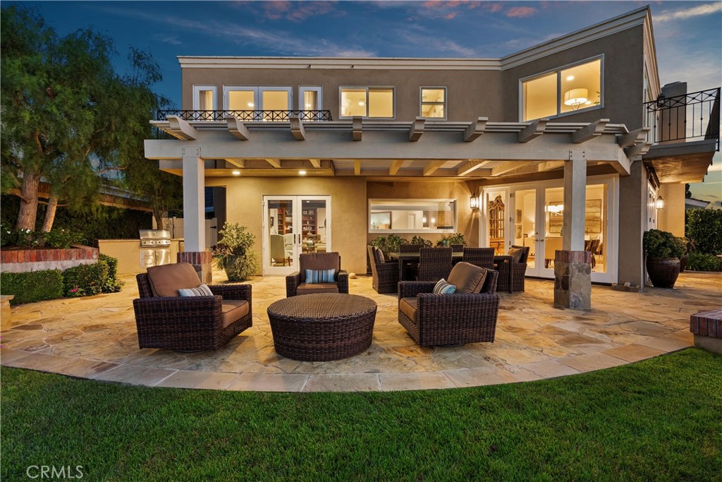 Nestled within the prestigious guard-gated enclave of Big Canyon, this exceptional residence is ideally positioned on a highly coveted, elevated oversized lot. It commands sweeping vistas, breathtaking sunsets, mountains, city lights, and the serene expanse of Upper Newport Bay. The thoughtfully expanded traditional floor plan features a luxurious primary suite oriented to capture the stunning views, complete with a spa-inspired en suite bath, an elegant walk-in closet, and a versatile view room currently utilized as a private fitness space. One of the additional guest suites offers a spacious sitting area and en suite bath, while the third bedroom features a hallway bathroom. Upon entry through the grand foyer, the main level impresses with rich Brazilian walnut flooring, soaring two-story ceilings, and an abundance of natural light that complements the refined, soft-toned color palette. Entertain with ease, whether hosting a formal dinner indoors or enjoying alfresco dining amidst a tranquil setting enhanced by a charming fountain. This distinguished property is available for lease either fully furnished or unfurnished, offering a rare opportunity to enjoy resort-style living in one of Newport Beach’s most sought-after communities.