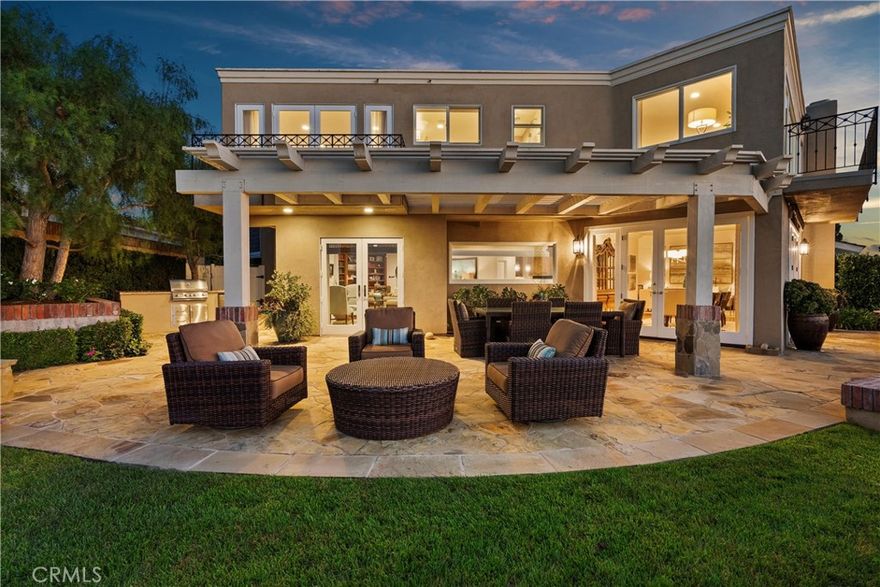 Nestled within the prestigious guard-gated enclave of Big Canyon, this exceptional residence is ideally positioned on a highly coveted, elevated oversized lot. It commands sweeping vistas, breathtaking sunsets, mountains, city lights, and the serene expanse of Upper Newport Bay. The thoughtfully expanded traditional floor plan features a luxurious primary suite oriented to capture the stunning views, complete with a spa-inspired en suite bath, an elegant walk-in closet, and a versatile view room currently utilized as a private fitness space. One of the additional guest suites offers a spacious sitting area and en suite bath, while the third bedroom features a hallway bathroom. Upon entry through the grand foyer, the main level impresses with rich Brazilian walnut flooring, soaring two-story ceilings, and an abundance of natural light that complements the refined, soft-toned color palette. Entertain with ease, whether hosting a formal dinner indoors or enjoying alfresco dining amidst a tranquil setting enhanced by a charming fountain. This distinguished property is available for lease either fully furnished or unfurnished, offering a rare opportunity to enjoy resort-style living in one of Newport Beach’s most sought-after communities.