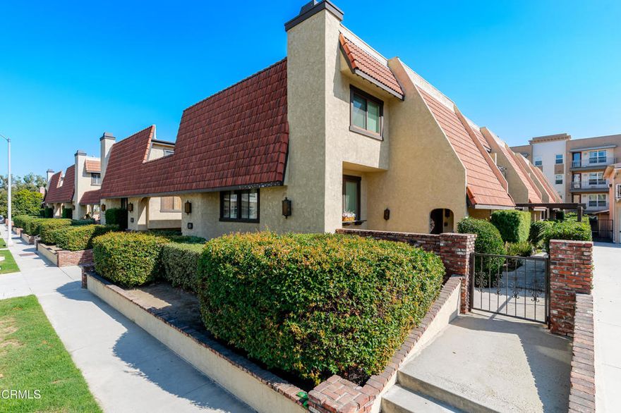 Welcome to this beautifully appointed townhome in the heart of Alhambra. Upon arrival, you'll be charmed by the peaceful front patio, a perfect spot to enjoy your morning coffee or unwind in the fresh air. Step through the double doors up into a spacious living room featuring an attractive brick fireplace and large windows that flood the space with natural light. Just beyond, the dining area offers space to enjoy intimate meals with loved ones or host dinner parties for guests, while the adjacent kitchen includes a breakfast bar and tile countertops. A convenient powder room completes the main level. Upstairs, you'll find three guest bedrooms, ideal for family, visitors, or a home office setup. The hallway bathroom features a shower-over-tub configuration and a skylight that brightens the space with natural light. The primary suite is spacious and boasts two large closets with built-in organizers, a private balcony, and an ensuite bathroom. The attached two-car garage offers easy access and convenience, with laundry hookups, a built-in workbench and storage cabinets, and a central vacuum disposal site, adding to the home's functionality. As a resident of Bay State Townhomes, you'll enjoy access to a relaxing spa, regular exterior maintenance, and close proximity to the shops and restaurants on Main Street in Alhambra. Don't miss this incredible opportunity!