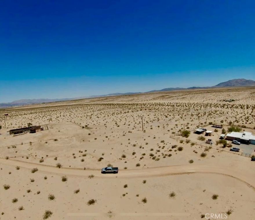 Endless Possibilities on 5 Raw Desert Acres in Wonder Valley. Escape to wide-open skies and the raw beauty of the Hi-Desert with this untouched 5-acre parcel in the sought-after Wonder Valley area of 29 Palms. Whether you’re a dreamer, a doer, or a visionary builder, this land is ready to become whatever you imagine—be it a serene desert getaway, off-grid compound, or long-term investment. The lot is situated near power access, with the option to install a well for water—giving you flexibility and freedom in how you choose to develop. With its flat terrain and panoramic views, it’s a natural fit for creatives, homesteaders, or anyone craving a personal slice of Mojave magic. Located just far enough from the city to feel remote, yet close enough to access amenities in 29 Palms, this property offers both privacy and potential. Address is fictitious for GPS identification purposes. Lot lines are approximate. Buyer to verify utility access, zoning, and all details through due diligence.