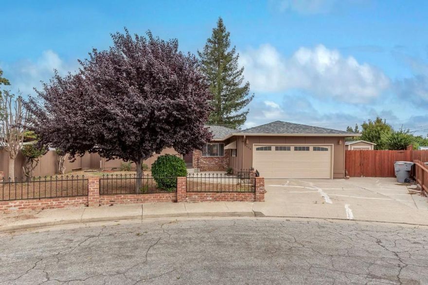 Gilroy home on a cul-de-sac with many upgrades. This single story home has 3 bedrooms, 2 bathrooms is over 1250 square feet, on a large spacious 8600 plus square foot lot. Some updates include, fresh paint inside and out, vinyl flooring (hardwood underneath), updated bathrooms, electric pellet heater in the fireplace, newer water heater, enclosed sun room currently being used as an office (unknown permits), finished epoxied garage floor, extra 16 foot by 8 foot storage in the backyard, RV and/or boat parking behind the gate & newer fencing. Close to parks, downtown, shopping & schools.