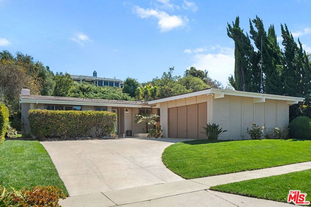 Discover a rare opportunity to own a thoughtfully updated mid-century retreat with future potential in sought-after Rancho Palos Verdes. The spacious living and dining areas set the tone in this inviting mid-century residence, where soaring vaulted ceilings and expansive six-foot sliding glass doors create an effortless connection to the private backyard. The open-concept layout is designed for both everyday living and entertaining, offering an ideal backdrop for gatherings. The kitchen is equipped with stainless steel appliances, a convenient breakfast bar, and washer and dryer hookups, combining style and function in a bright, central space. Three well-proportioned bedrooms feature large picture windows that flood each room with natural light. The primary suite and secondary bedrooms are thoughtfully arranged to provide both privacy and flexibility for a variety of lifestyles. Outside, the backyard is a true extension of the home. Mature landscaping frames multiple areas for outdoor dining, recreation, and relaxation, creating a private oasis with room to expand or customize. Recent upgrades include wide-plank wood flooring, fresh interior paint, and a dual-fuel fireplace offering both gas and wood-burning options. Set on a generous 9,021 square foot lot and ideally located near top-rated schools (including Ridgecrest Intermediate School), this home offers move-in-ready comfort, future potential, and enduring value in a sought-after neighborhood.