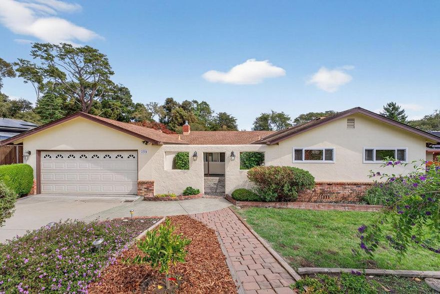 Welcome to this charming home located in the vibrant coastal community of Aptos. This home is only a 15 minute walk from Cabrillo College!  This spacious residence boasts four bedrooms and 3 full bathrooms, offering ample space for comfortable living. It is also located on nearly 1/2 acre of land with plenty of room and an expansive deck to enjoy the outdoors.   Enjoy meals in the open dining/living room area or relax in the separate family room, perfect for gatherings. The living and family rooms both feature fireplaces.  The home features a mix of carpet, hardwood, and vinyl/linoleum flooring, adding variety and style to each room. Stay cozy during cooler months with the fireplaces and forced air heating, while ceiling fan provide cooling options in warmer seasons. Set within the Pajaro Valley Unified School District, this property offers proximity to local schools. With 1,957 square feet of living space, this home provides both comfort and functionality. The attached two-car garage adds storage and parking convenience.  There is even RV parking next to the garage.  PLEASE NOTE: Some photos have been virtually staged.