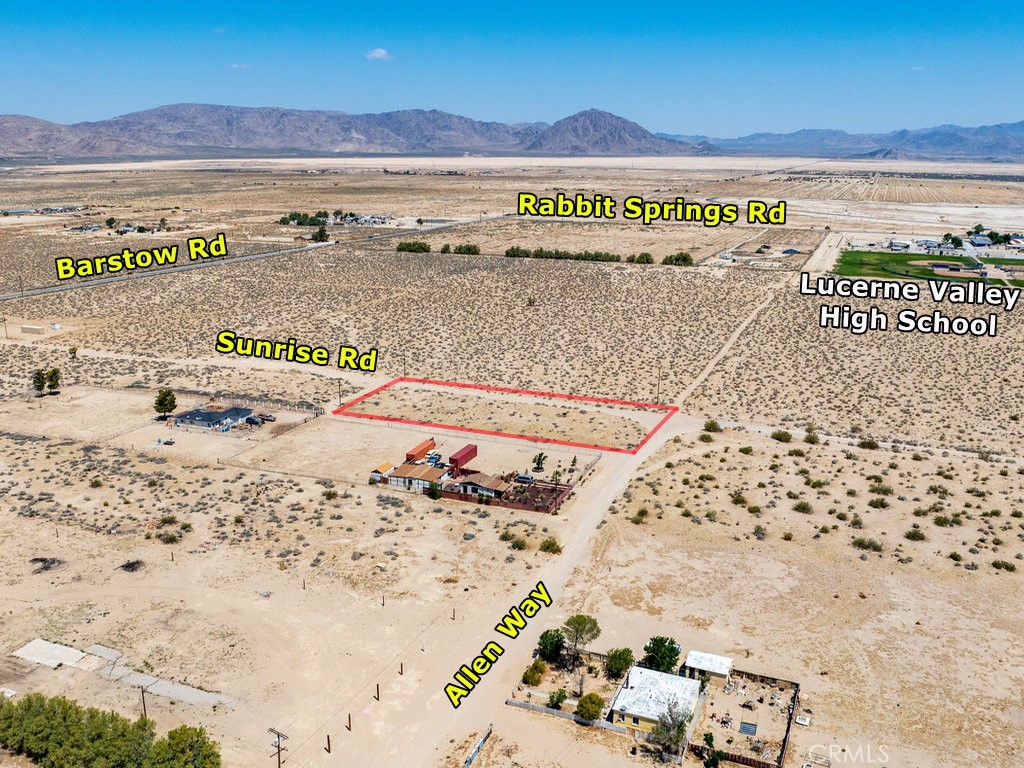 Great Location. Strategically located! It’s about 1000’ away from paved Barstow Rd and 0.5 mile away from Hwy 18 (Old Woman Springs Rd). It is also situated at the SW corner of Sunrise Rd and Allen Way. Power lines are on property and along Sunrise Rd while private well and septic tank are necessary and common in the area. Apple Valley, Victorville and everything you need is just a short drive away. This lot is in San Bernardino County jurisdiction and zoned for LV/RL (Lucerne Valley/Rural Living) which allows for single family homes and incidental agriculture uses. This is really an unique opportunity to enjoy a peaceful desert lifestyle with expansive open spaces and breathtaking natural beauty. Do not miss this opportunity to make your dream come true on this blank canvas. Please note that the boundaries represented in the photos are only an estimation. Buyers should verify boundaries, zoning and utilities, ensuring every aspect aligns with their vision for the property. Address has been assigned by county.