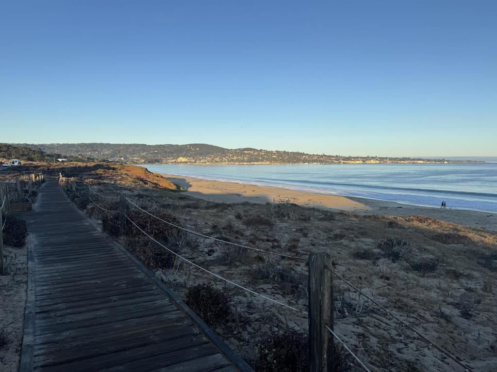 Live just steps from the sand at Del Monte Beach in this bright and breezy 1-bedroom, 1-bath condo. Offering the ultimate Monterey lifestyle, this rare beachside unit combines coastal charm with everyday convenience. Inside, the open-concept layout features hardwood floors, a well-appointed kitchen with bar seating, and large sliding doors that open to a private balcony, perfect for morning coffee with ocean views and the sound of the waves. The spacious bedroom includes ample closet space and a stylish vanity, while natural light fills the home throughout. Located within a secure gated community with covered parking, youll enjoy direct access to beach boardwalks, the Rec Trail, and Monterey Bays shoreline. Just minutes from Cannery Row dining and local attractions, this condo makes an ideal weekend retreat, full time residence, or investment. Priced more competitively than any comparable sale in the past three years, this is coastal living at its best, an opportunity not to be missed.