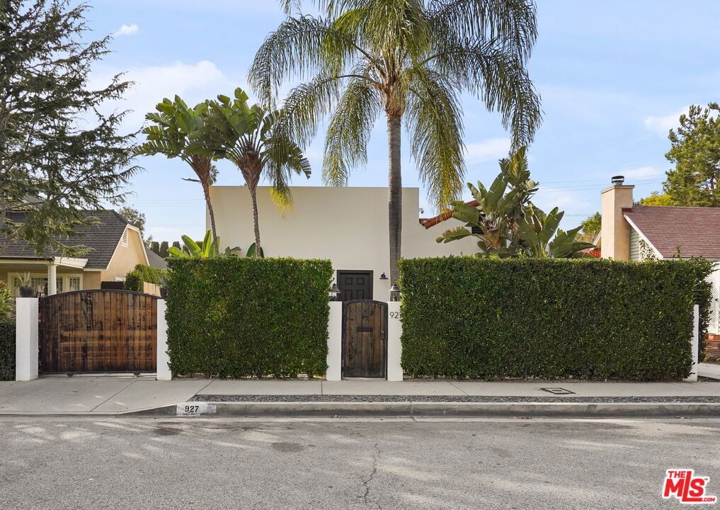 Discover your private Spanish Modern style gated oasis in the heart of Melrose Village, just a short walk to restaurants and parks. Oak hardwood floors, abundant natural light, and carefully chosen design details create a welcoming, modern vibe.The floor plan strikes the perfect balance, with the chef's kitchen enjoying the spotlight, connecting the cozy living spaces to the outdoors for al fresco dining and entertaining.The primary suite is a spacious retreat with spa-like bathroom with a picture window and oversized shower. The primary suite features French doors leading to the secluded backyard. The outdoor areas are a generously sized patio, a front yard zen space, and a lush grassy yard cocooned by trees for that extra privacy. The two car garage can be used as additional entertaining space with plenty of parking behind the gates. This home is not just a residence, it's a vibe!