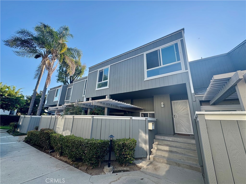 Discover an exquisitely renovated Craftsman-style townhouse in Santa Ana’s premier neighborhood, featuring soaring beamed ceilings, a spacious two-car garage. The open-concept design seamlessly blends an over-sized gourmet kitchen boasting a central rolling island. The upper level offers a primary suite and outdoor patio. Two other upstairs bedrooms feature fresh paint, new flooring, accompanied by a fully renovated bathroom. A BBQ patio off the kitchen allows for hosting with ease. Access to a community pool and spa is ideal for summer days. Ideally located just 20 minutes from Disneyland, beaches, UCI, and local colleges, this home offers refined Southern California living at an exceptional value, ready for you to move in and embrace its vibrant community.