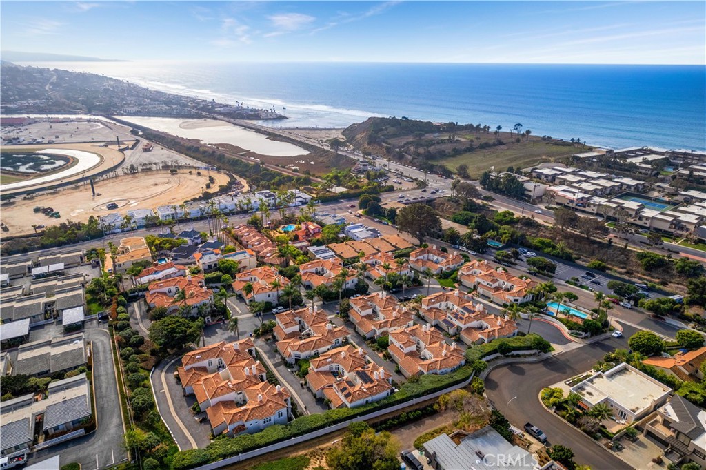LOCATION, LOCATION! Luxurious end unit, Oceanview Townhome in the heart of coveted Solana Beach, located in the gated community of La Mer. This exquisite 3-bedroom, 3 bath home boasts ocean views. Just moments from the stunning Pacific Coastline and WALKING DISTANCE TO DEL MAR RACETRACK. This is a haven of luxury and coastal charm. To show or see, text or call 858-215-2513 or 619-846-9487. As you enter, you'll immediately be drawn by the High-End Quality Finishes of this stunning unit, Travertine floors. The living room is bright and airy, featuring large windows with shutters that showcase the views of the Pacific. The primary suite, featuring a luxurious ensuite bathroom with dual sinks, a large soaking tub and access to private patio with above ground jacuzzi. The back covered patio offers plenty of room to relax and unwind with ocean views. The attached 2-car garage provides added convenience and storage space. Other features include solar to help with the increasing electric bills, wired for electric car charging, indoor laundry room. Comes partially furnished. Located just steps away from local shops, restaurants, and Cedros, this property offers the ultimate coastal lifestyle. You'll also enjoy easy access to some of the area's top schools and the freeway, making it a convenient location for families and commuters alike.