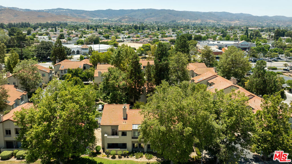 Tucked away in the peaceful Sycamore Terrace community, this charming unit offers a fantastic place to call home or investment opportunity. Step inside one of the community's largest floor plans and find an updated kitchen and dining area, sunken living room with natural light, cozy fireplace, two well-appointed bedrooms, updated bathroom, and private patio. The unit also comes with your own in-unit washer and dryer. Additional features include two designated parking spaces with one garage parking spot and private storage, plus a second outdoor assigned parking spot, both conveniently located directly outside your front door. Additional storage locker in the garage. Enjoy access to a wealth of community amenities that include a pool, spa, tennis courts, basketball courts, multiple green spaces, playground and optional RV parking. Located just blocks from shopping, dining, Trader Joe's, Target, and easy access to the 118 freeway, this is Simi Valley living at its finest. Come see it today!