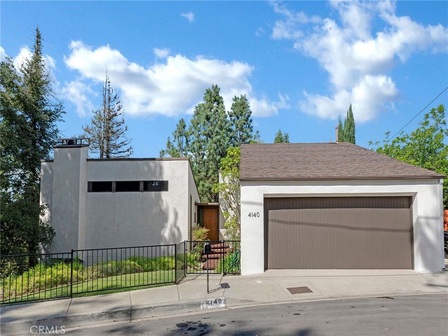 Welcome to 4140 Cachalote Street, a hidden gem in prime Woodland Hills with timeless mid-century modern character and endless potential. Spanning 2,401 sq. ft. on a generous 7,554 sq. ft. lot, this 3-bedroom, 2.5-bath two-story residence evokes a “Frank Lloyd Wright” inspired design and has been lovingly cared for by the same family since 1976. Now, for the first time in decades, this remarkable property is ready for a new chapter—whether that means updating it into your dream home, reimagining it with a modern edge, or creating a profitable investment.



The main level welcomes you with soaring vaulted ceilings, an open-concept kitchen and dining area with newer wood flooring, and a bright living room that opens to a rear deck with treetop views. A convenient powder room completes the upstairs. Downstairs, three spacious bedrooms await, including the primary suite with an en-suite bath and large closet. Throughout the home architectural details hint at the exciting design possibilities waiting to be uncovered.



An oversized direct entry two-car garage with a custom loft for storage offers even more flexibility, while central air and heat and a dedicated laundry room add everyday convenience. Outside, the rear yard is a blank canvas—envision weekend gatherings, lush gardens, a spa retreat, or even a striking water feature. Developers and flippers will recognize the potential, while end-users will see the opportunity to craft a one-of-a-kind retreat in a highly coveted neighborhood.



The location couldn’t be better—just moments from Serrania Park, award-winning schools, and top shopping and dining such as Whole Foods, Trader Joe’s, Costco, The Village, Westfield Topanga, Joey, Ruths Chris and more! Commuters will appreciate easy access to Ventura Boulevard and the 101 freeway. Hiking and cycling along Mulholland Drive is just steps away and offers beautiful, panoramic views of the valley, Woodland Hills Country Club is moments from your front door, while the beach is just a scenic 30-minute drive away. Don’t miss this rare opportunity to transform a mid-century treasure into a modern Woodland Hills masterpiece.