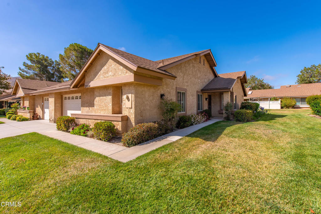 Welcome to one of the most popular models at Leisure Village! Don't miss the opportunity to own this Holmby II in Camarillo's premier 55+ gated community. Beautifully refreshed 2-bedroom, 2-bath home is filled with warmth, charm, and thoughtful upgrades throughout. Features dual-pane windows, plantation shutters, smooth ceilings, recessed lighting, and wood-like flooring throughout the main living areas, as well as newer plush carpet in the bedrooms. The light-filled, spacious living room, with its vaulted ceiling, flows seamlessly into the dining area. At the same time, the bright kitchen boasts granite counters, stainless steel appliances, ample cabinetry, and offers a peaceful setting. The oversized primary suite is a true retreat, featuring a large walk-in closet and a fully remodeled en-suite bath that showcases a tiled shower, an updated vanity with granite countertops, double sinks, newer lighting, and mirrors. The second bedroom is generously sized and ideal for guests or an office, while the remodeled hall bath includes an updated vanity, walk-in shower, and modern finishes. Enjoy the practicality of an indoor laundry room and direct access to an oversized one-car garage with storage. Step outside to a lovely, covered patio with a block wall for added privacy, making it perfect for morning coffee or relaxing in Camarillo's year-round temperate climate. This home is located outside of the flood zone, meaning most lenders will not require flood insurance. Residents of Leisure Village enjoy an unmatched array of amenities, including a par-3 golf course, an Olympic-size pool and spa, tennis and pickleball courts, a fitness center, billiards, a woodshop, a ceramics studio, a library, and dozens of clubs and social activities. HOA dues cover water, sewer, trash, basic cable TV, internet, landscaping, and insurance, leaving only electricity for you to manage. With its thoughtful upgrades, functional layout, and vibrant community lifestyle, this home presents an exceptional opportunity to experience the best of active senior living. Welcome home!