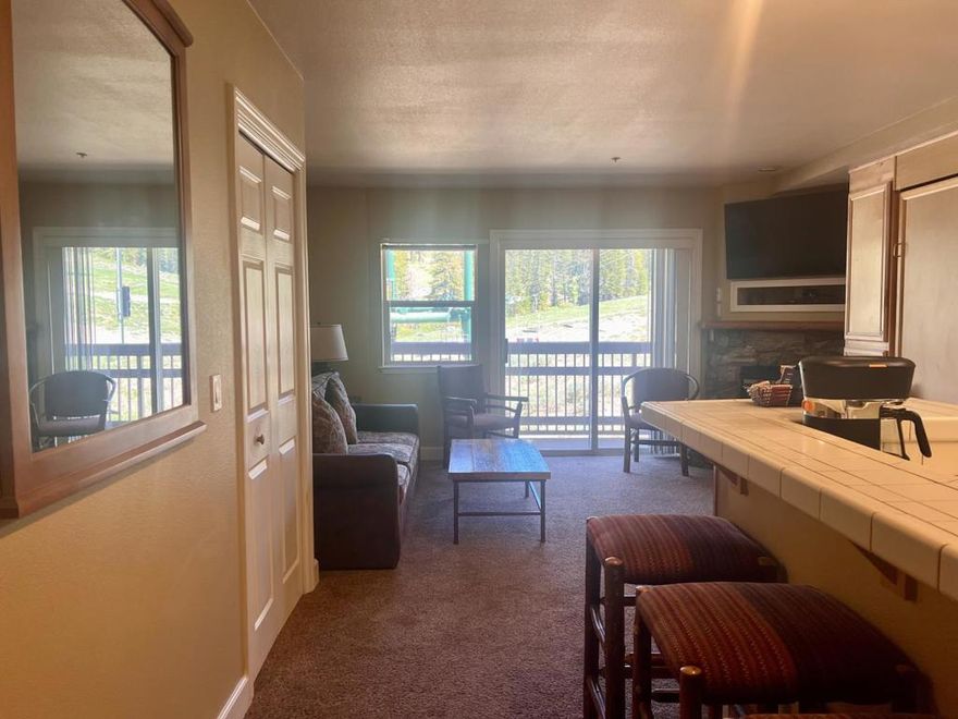 Take in stunning mountain views of Lifts 10 & 11 from your private deck at Kirkwood Ski Resort. Set up as two-connected units that sleep up to eight, this 1-bedroom ski-in/ski-out condo is a 1/8 fractional ownership. One side includes 2 queen beds, a cupboard kitchenette, full bath with tub/shower, closet, and deck. The adjoining unit offers a Murphy bed, sofa bed, full kitchen with dishwasher, full refrigerator, microwave and stove, fireplace, full shower/bath, and closet. With two entry doors and an interior connection, you can use one side and rent the other or close the door for privacy. Modern perks include streaming TV, high-speed internet, and digital entry. Ownership provides one week every other month, plus the option to rent other units for just a cleaning fee when available. Amenities feature a fitness center with dry/steam saunas, outdoor hot tub, and storage. You will also have private membership to the KCA recreation center with a new pool, hot tubs, fitness center, and restaurant/bar across the street. Reserved covered parking and a private owners storage cabinet are included. Additional benefits include global exchange through Interval International with access to 2,000+ resorts worldwide.