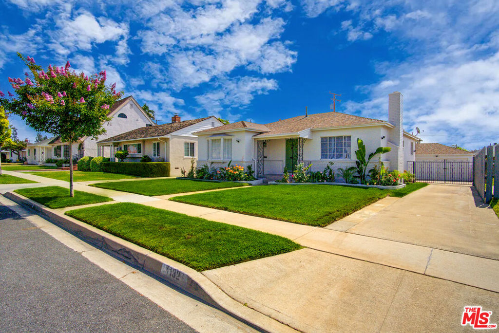 Dreaming of a haven framed by vibrant blooms on a serene street in Alhambra? An inviting path draws you into this beautifully remodeled single-story residence, where modern upgrades and timeless touches create a welcoming sanctuary! Recessed lighting, crisp white hues, and wide-plank flooring set a fresh, refined tone throughout the interior, as sunlight pours in via bright windows. Your living room centers around an elegant fireplace with a classic mantle, while the adjacent dining alcove enjoys warmth from its picture window. In the kitchen, stainless steel appliances, luminous countertops, and ample cabinetry make cooking feel effortless. Two restful bedrooms share a sleek bath, and a flexible bonus room flows into your family corner, ideal for work, play, or relaxation. Venture outside to a secluded backyard with a generous patio ready for weekend BBQs. A gated driveway leads to a detached 2-car garage complete with a built-in workbench and shelves. Located near CSU LA, parks, shops, and major freeways, this home offers a lifestyle that's inspiring. Discover comfort amidst all the possibilities it holds!