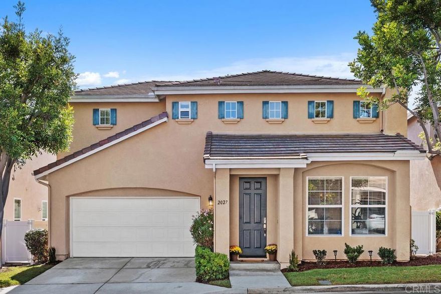 Discover the charming, gated community of Heritage-Legends, nestled within the beautifully master planned community of Shadowridge in Vista, CA. This residence boasts the largest floor plan available in the Heritage development, offering just over 1,700 square feet of spacious and comfortable living. Upon entering the home, you are greeted by an open floor plan of the formal living and dining rooms. These spaces feature a cozy fireplace and vaulted ceilings, creating an inviting atmosphere ideal for entertaining or relaxing with family and friends. Continue into the family room and kitchen area to find a newly renovated kitchen equipped with elegant cherry cabinets, quartz countertops, stainless steel appliances, and a walk-in pantry. Adjacent to the family room and dining nook, a charming patio offers the perfect setting for gardening, enjoying time with pets, or savoring your morning coffee. On the upper level, a spacious loft overlooks the downstairs living area. This versatile space is perfectly suited for use as an office, game room, or as an optional fourth bedroom to fit your needs. The primary bedroom, located at the top of the landing and accessible through double doors, features an ensuite bath with double vanities and a walk-in closet for ample storage. Two additional bedrooms and a conveniently located bathroom complete the upstairs layout. The property includes a two-car garage and a driveway, providing secure and convenient parking options for residents and guests. Shadowridge, Vista is a vibrant community of North County San Diego - situated adjacent to Carlsbad and Oceanside - just a few miles inland from the scenic California coast. It’s home to the Shadowridge Golf Club, Buena Vista Baseball Fields, and Buena Vista Community Park which features a tranquil duck pond and three miles of picturesque walking trails. Experience all the wonderful amenities and natural beauty that the Shadowridge community has to offer.