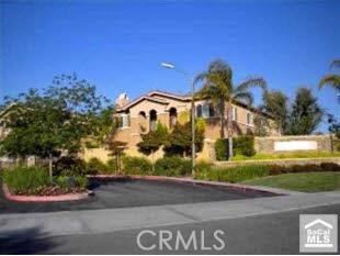 Beautiful first-floor unit in the highly desirable gated Arboretum community. Features a bright living/dining area with electric fireplace and slider to covered patio, functional kitchen with stackable laundry, and bedroom with mirrored wardrobe. Tile flooring throughout with new carpet in the bedroom. Includes a detached 1-car garage nearby. Community amenities include gated entry, pool, spa, BBQ area, playground, and fitness center. Close to parks, schools, and freeway access.