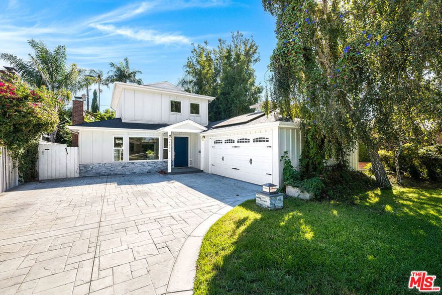 Welcome to this charming home tucked away on a quiet cul-de-sac in the coveted Burbank side of Toluca Lake. Blending the best of both worlds, the property offers the convenience of Burbank servicespolice, fire, and award-winning schoolswhile being just moments from the shops and dining of Toluca Lake Village. The formal entry opens to a spacious living room with hardwood floors, a cozy fireplace, and a bay window that floods the space with natural light. The dining area with wainscoting and built-ins adds character and warmth. The updated eat-in kitchen boasts top-of-the-line appliances, perfect for any home chef, while the sunroom provides a bright retreat with direct access to the outdoors. The private backyard is ideal for entertaining, featuring a grassy lawn, shaded gardening area, and a patio with built-in fire pit. Additional highlights include an attached two-car garage with workbench, overhead storage, an electric car charger, and a generous driveway. This private retreat offers timeless charm, modern upgrades, and an unbeatable locationjust minutes from studios, fine dining, and all that Toluca Lake has to offer.