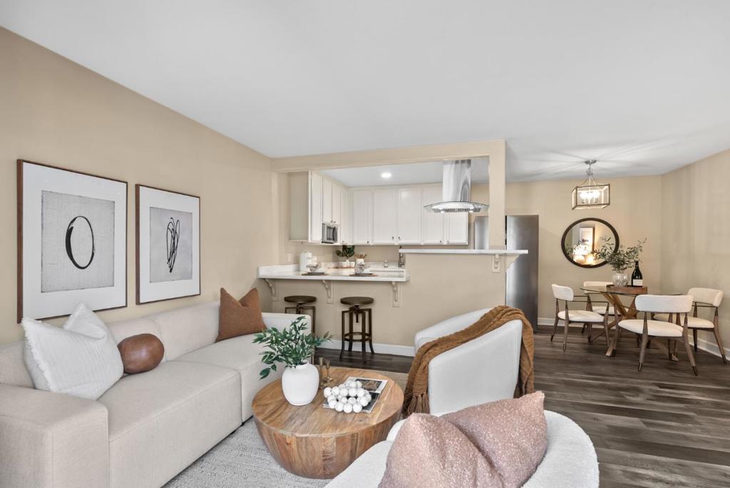 Fresh Price Cut! Nestled in a tranquil community within the highly sought after Campbell neighborhood, this remodeled condo is located on the ground level, eliminating the need to navigate stairs. The open kitchen features a updated quartz slab countertop, freshly painted cabinets, and brand-new stainless steel appliances. The layout flows effortlessly into the dining and living areas, enhanced by an elegant chandelier, updated rich laminate flooring, and recently added recessed lighting throughout. Both bedrooms are spacious, with one generously sized, making it ideal for a combined bedroom/office setup, complete with newly installed features such as the wall heating. The larger bedroom boasts a walk-in closet and enjoys the advantage of having no upstairs neighbors. Both bathrooms feature newer fixtures and lighting. This home promotes indoor-outdoor living with a private patio, along with updated interior laundry and a detached one-car garage, and two additional spaces. Community amenities include a pool, and the HOA dues cover water and garbage (buyer to verify). Conveniently located near top-rated Farnham Elementary and Price Middle schools, as well as commuter routes, hiking trails, and your pick of downtowns Los Gatos and Campbell. A turnkey home in a prime location.