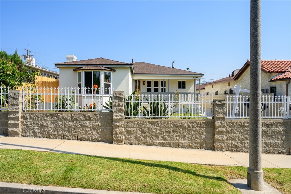 Beautifully RENOVATED 3-bedroom, 2-bathroom home located in sought after El Sereno Neighborhood. Situated on a large 7000+ square foot lot with a fully enclosed front and backyard, this home offers plenty of space for outdoor fun and entertainment. The spacious living room is filled with natural light and looks on to the landscaped front yard and features a decorative fireplace. The kitchen has new custom two-tone cabinets with ample space, sleek new counter tops, new fixtures, stainless steel appliances, and full tile backsplash. Both the hall and primary bathrooms have new vanities and custom tile work. Other features include freshly painted interior and exterior, luxury flooring throughout the living area and bedrooms, dual pane energy efficient windows, stylish new electrical and plumbing fixtures, new AC and heating system, new electrical panel, and new roof. The laundry area is conveniently located inside just off the kitchen. There is an enclosed patio (approximately 240sf) as well as a covered patio off the garage with a low maintenance back yard. Detached two car garage and long gated driveway offer plenty of off street, secure parking. Conveniently located within walking distance of the adored lil'East Coffee and short distance to El Sereno's vibrant main street and local hot spots including Debs Park, The Greyhound Bar, Zizou, Antigua Bread, Ascot Hills Park, Don Tonos, and more as well as an easy commute to downtown Los Angeles and Pasadena.