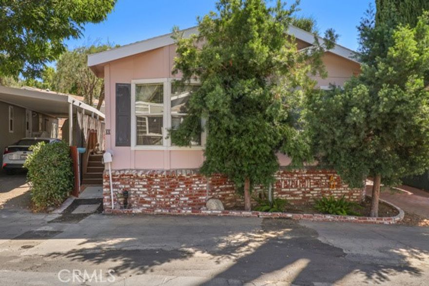 Gorgeous Home in Immaculate condition , turn key &  Pride of Ownership inside and outside of this  home. Very Well manicured and maintained,  3 bed 2 bath home that is very spacious, third bedroom is a bonus room can be used for an office workout room etc!!!  Home is clean, no repairs needed, extra bonus room, large primary bathroom, spacious closets . The kitchen has an open floor plan with a spacious kitchen & plenty of upgrades; granite counter tops , stainless steal appliances,  refrigerator with built in ice maker, gas stove top, double oven, spacious cabinets, easy slide and close drawers. Laundry has its own room side by side with plenty of space. High Vaulted Smooth Ceilings with recessed lighting, ceiling fans, custom made window covers , engineered hard wood flooring, and a storage shed for extra storage space. Primary room has a spacious primary bathroom attached. Well manicured and maintained backyard and porch area for entertaining and relaxation with an upgraded fence for privacy and an extra built in terrace for relaxing. The Open floor plan expands from the kitchen out into the living room area which offers convenience  of luxury, comfort, and style. This home offers a dining area with a window view and has  bright full length windows for birdwatching. New custom paint,  brand new tile, plenty of upgrades and extras included with this home. This home is located in the highly desired Chaperelle Elementary and Calabasas High School zoned area which is well known for the honor of being recognized as a National Blue Ribbon School, a California Distinguished School, a California Gold Ribbon School, a California Gold Ribbon Arts School, and a U.S. News World & Report Silver Medalist. The park offers a lovely pool ready to use year round and provides plenty of guest parking.
