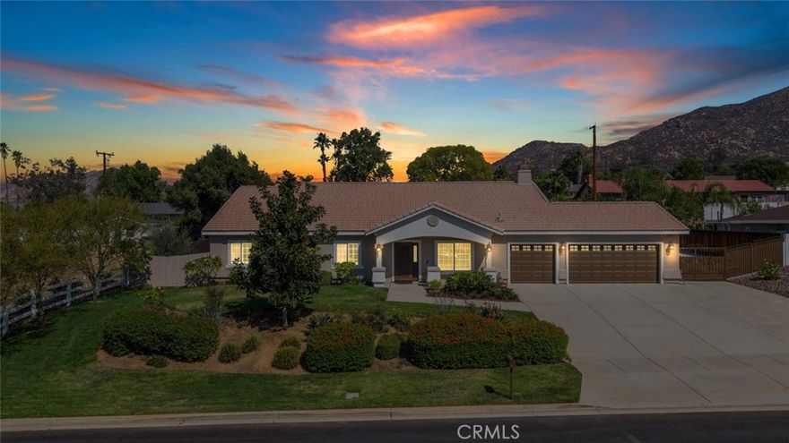 Welcome Home! This single story ranch style home is a rare find! Situated on a 27,442 square foot lot with gated oversized RV/boat parking. This home is stunning and immaculately maintained! Offering approximately 2,662 square feet 4 bedrooms and 3 bathrooms. Ceramic plank tiles (wood looking) throughout all main areas of the home. Oversized primary bedroom and bathroom that features dual sinks, stand alone shower and deep soaking tub, with a large walk in closet. Chefs dream of a kitchen, this expansive kitchen is great for family get togethers or entertaining! HUGE oversized island with bar seating, granite countertops, stainless steel appliances, and walk in pantry. The dining room is just off the kitchen, with all three spaces; Kitchen, dining and family room merging to create a massive open flowing space that works seamlessly together. Additional interior features include, ceiling fans, mirror wardrobes, high ceiling and gorgeous custom plantation shutters throughout and so much more. An individual indoor laundry room with cabinets. The backyard is just AMAZING with a patio cover that expands the full length of the home, and two individual free standing alumawood pergola's with ceiling fans. Artificial low maintenance grass, garden, fruit trees, (orange, lime, lemon, avocado, all fruit bearing trees and a private gated dog run! For those with an adventurous spirit, the property includes dedicated RV parking, ensuring your travel-ready vehicle has a secure spot. Still more room to. add a boat or more toys and or work vehicles. The exterior of the home has just been repainted! Low taxes and no HOA. This home is a rare find, move in ready and so well cared for it feels new! Don’t Miss Out! This home will sell fast.