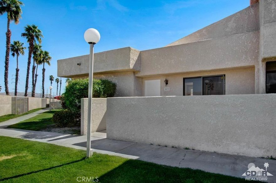 Priced to sell! This is truly a rare find in Rancho Mirage Resort. This updated 2 bedroom/1 bath condo is an end unit, no stairs, no one above you and has a two car garage! The condo features tiled floors, granite counter tops in the kitchen and bath, new cabinets with soft close doors and pull out shelves and stainless steel appliances. You'll enjoy the large front patio on a greenbelt with fabulous mountain views. In addition, the condo was designed for wheelchair accessibility with wide doorways, a larger kitchen and bathroom. And no land lease! Rancho Mirage Resort is a gated community with pools, hot tubs and tennis. Call for more information!
