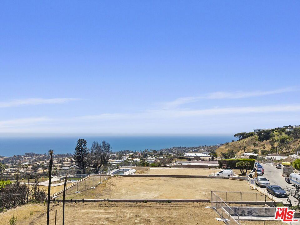 Exceptional View Lot Situated in the highly desirable upper Marquez Knolls neighborhood. This remarkable 9,000+ square foot lot offers breathtaking panoramic views overlooking the San Bernardino Mountains, downtown Los Angeles, and stretching across the city basin to the iconic Queen's Necklace from Palos Verdes to Malibu. The expansive vista encompasses the full splendor of the Santa Monica Bay and Catalina Island, providing a truly spectacular backdrop. Located less than a 10-minute walk from a trailhead into the Santa Monica Mountains National Recreation Area, residents have direct access to scenic hiking trails connecting to Temescal Canyon, Will Rogers State Park, and the Backbone Trail leading to Ventura County. The property is also within walking distance to the charming Palisades Village and Will Rogers State Beach, offering convenient access to shopping, dining, and outdoor recreation. Prior to the fire, the lot featured a spacious 3,400 square foot single-level home with 3 bedrooms and 4.5 baths. The residence boasted a large kitchen and family room, an open dining and living great room, a den/office, expansive patio, and a 2-car garage. The owners have maintained and will include full plans for a comprehensive remodel from studs and slab completed in 2006, providing a seamless foundation for new construction or renovation.In addition to its stunning views and prime location, this lot offers privacy, tranquility, and close access to multiple public and private schools making it a perfect opportunity.