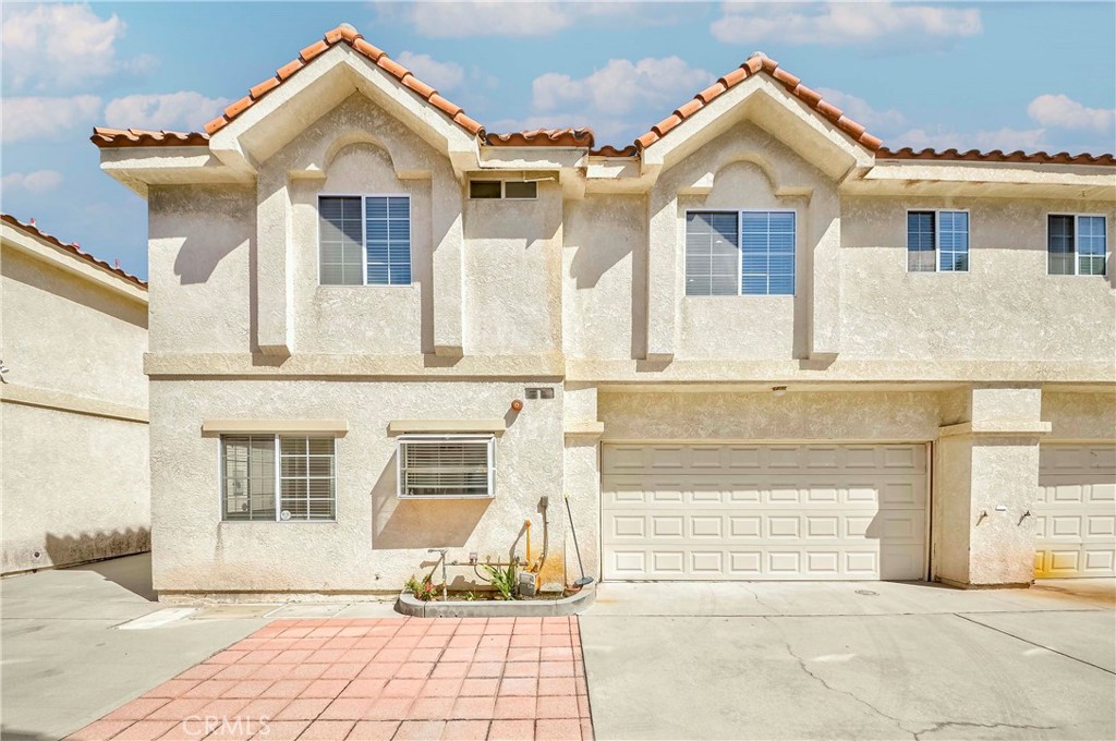 Private and quiet inside end unit! This remodeled townhouse offers 3 bedrooms, 3 bathrooms, plus a spacious loft. Recent updates include new waterproof wood-style flooring, light fixtures, and fresh paint. The living room features a fireplace, and the kitchen has granite countertops, shaker cabinets, a full backsplash, and stainless steel appliances. Bathrooms have been upgraded with new tubs, custom tile, and modern fixtures. The loft can be used as an office, study, or playroom. The primary bedroom has a walk-in closet and private bath. Convenient in-unit laundry and an attached 2-car garage with direct interior access. Located on a premium lot with extra privacy and additional assigned guest parking. Low HOA fee of $240 covers insurance, trash, sewer, and water. Part of the highly rated Temple City Unified School District. Close to shopping, dining, and schools.