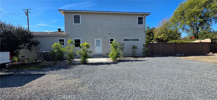 This is a unique commercial or residential rental that can be utilized as an office with a primary sized bedroom.  Live and work from home.  It contains a new private kitchen with laundry hookups along with an upstairs bedroom and luxury bathroom.  Just completed: all new interior.  The 1/4 acre gravel parking area can accommodate the largest of vehicles.  There are restrictions on the amount of vehicles that can be stored.  The location is ideal for easy freeway access to the 71, 60, 10, and 91 freeways.  If you are not running a business and do not need the large electric gated parking/vehicle storage area the lease can be $2500 per month for just the apartment.  All utilities are included!   The main house is currently used by the owner.