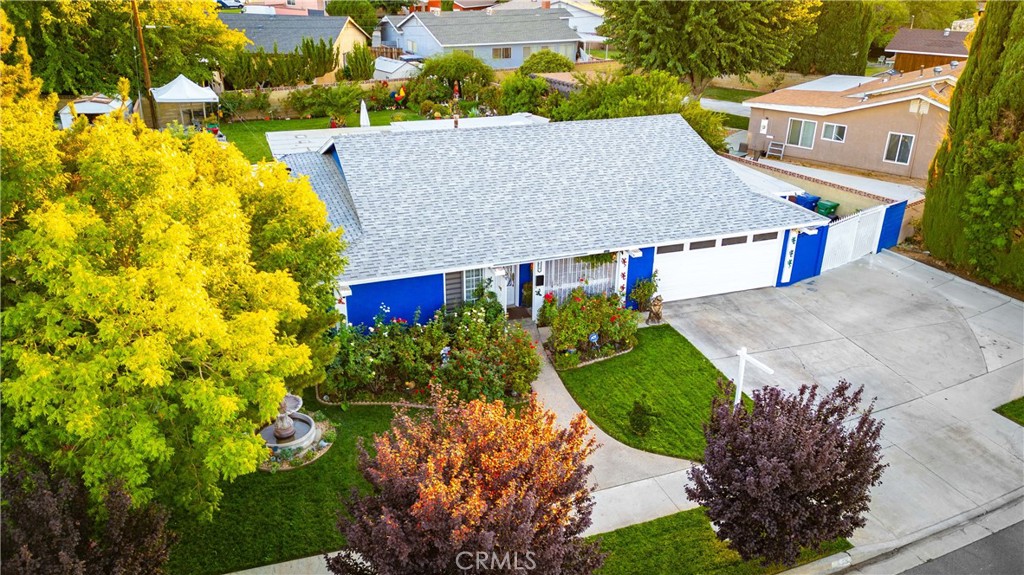 Over 11,000 sq. ft. lot with a sparkling pool, waterfall pond, and a beautifully landscaped yard make this Lancaster home a rare find. Featuring 4 bedrooms, 2 bathrooms, and a versatile bonus room that can be used as an entertainment space, office, playroom, or more, this single-story residence offers both comfort and functionality. A two-car garage and potential RV access add extra convenience.
Inside, the kitchen showcases granite countertops, stainless steel appliances, stylish backsplash tile, and plenty of cabinets, seamlessly connected to the dining area. The living space offers ceramic tile flooring and a functional open layout that provides plenty of room for relaxing or entertaining.
The backyard is designed for entertaining and relaxation with a sparkling pool, shaded patio, fruit trees, and well-maintained green grass. A tranquil pond with rock waterfall enhances the outdoor ambiance, while the covered patio provides a cozy seating area perfect for gatherings. The front yard is equally inviting with mature landscaping, a decorative fountain, where you can sit back and enjoy the view.
Conveniently located near shopping, dining, schools, and parks, this home offers both comfort and accessibility for everyday living. Don’t miss the opportunity to make this exceptional property your own.