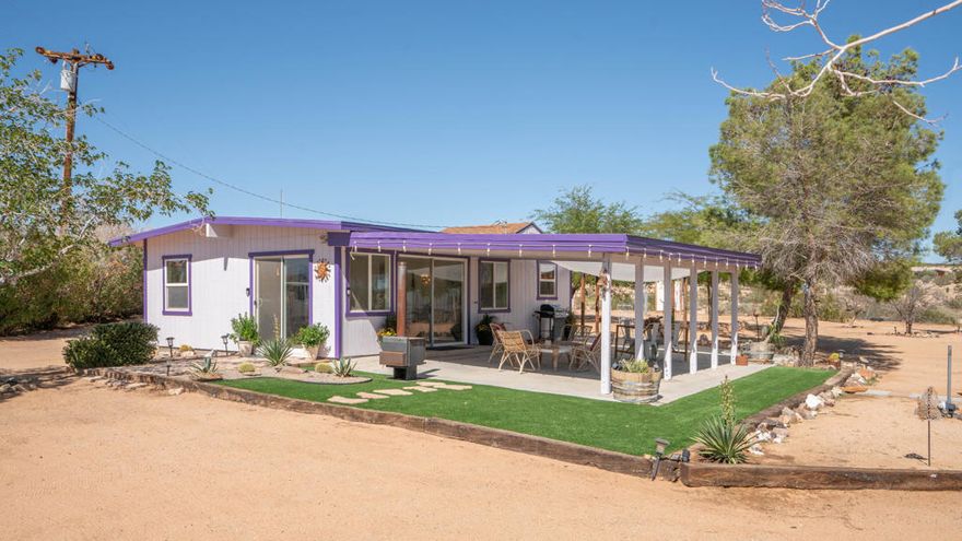 Calling all Horse Enthusiasts, Horse Trainers and those looking for a fabulous equestrian property. This wonderful Equestrian-Friendly Desert Retreat with your own Yurt on 5 Acres in Joshua Tree is it! Thoughtfully remodeled 1-bedroom, 1-bath home with a loft (approx. 660 sq. ft.) pairs modern comfort with true desert living. The open and inviting living room is spacious and has large picture windows that flood the interiors with natural light and frame sweeping mountain vistas. Outside, an expansive covered patio creates a generous setting for entertaining and lots of areas around the property to just sit, take a break enjoy the beauty of your surroundings. Property Highlights-Fully perimeter-fenced 5 acres: ideal for horse enthusiasts and animal lovers alike.-Equestrian facilities: 3 covered horse shelters with 50 ft paddocks, fencing and cross-fencing, round pen, turnouts, and a nice size tack shed. Lots of room for your horses to run and play or turn this property into a lovely training facility with lots of options for you and your horses. Lots of areas to ride and trails all over-Yurt with private deck: versatile bonus space perfect for guest accommodations, yoga, meditation, or creative work. - Outdoor amenities: low-maintenance landscaping with mature trees, rock/desert scape throughout, a cowboy soaking tub for beautiful sunny days or those gorgeous starry nights, and a rustic trellis-covered fire-pit area- Practical setup: RV hookups, storage containers, a large covered parking structure and all of it is flat usable land with tons of room to pull that truck and trailer in and out or to expand on the property. Small in size yet impressively efficient, this home delivers a seamless blend of indoor-outdoor living, rustic charm, and equestrian functionality. Welcome to an inviting, peaceful equestrian retreat in the heart of Joshua Tree.Buyer to verify all information. Buyer is advised to conduct all independent inspections and investigations of the property (including, without limitation, permits, square footage, lot size, boundaries, zoning/use, systems, and neighborhood rules) and to rely solely on Buyer's own findings. Seller and Brokers make no representations or warranties.