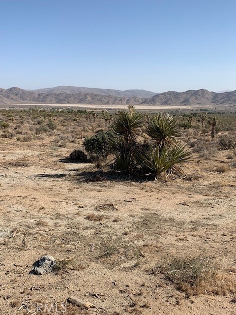 . Enjoy the stunning views of the Valley and mountains on these 10 acres property with water well and close to Hwy 18, Big Bear, Barstow, Johnson Valley, and Apple Valley. Whether you are looking to build the house of your dreams or just as and investment, this property will suit your needs.