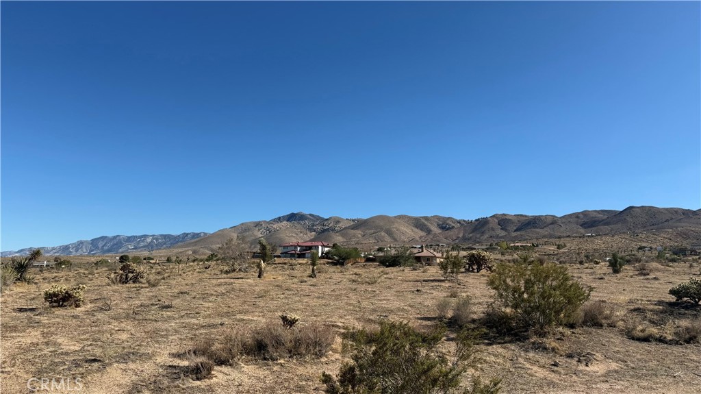 Nestled in the tranquil community of Fizzben Heights in Apple Valley, this exceptional parcel offers breathtaking views and endless potential. Perfect for building your dream home or adding to your investment portfolio, it combines natural beauty with everyday convenience. Known for its peaceful atmosphere and friendly neighbors who look out for one another, Fizzben Heights offers a true sense of community. With nearby utilities, a stunning desert backdrop, and a price set to sell quickly, this property presents an incredible opportunity—plus, the seller may consider financing, making it even easier to own your piece of Apple Valley’s scenic landscape.