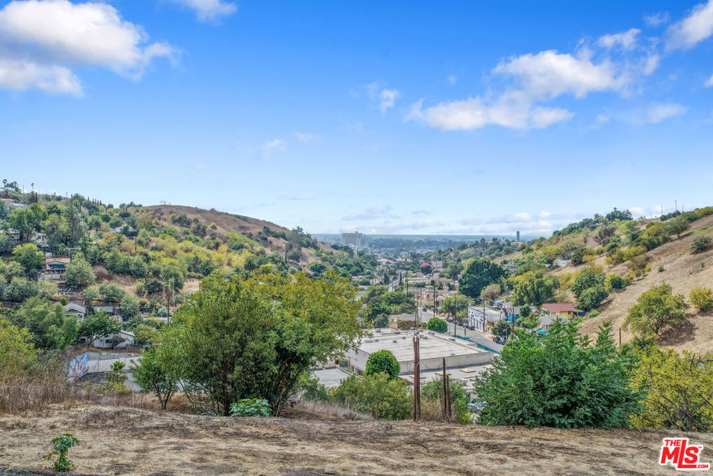 Discover this lot in the sought-after community of Montecito Heights! This vacant hillside parcel offers peaceful, scenic views and is ideally situated on a residential street, adjacent to a designated Open Space Zone (buyer to verify), providing a sense of privacy and natural beauty. Montecito Heights is one of Northeast LA's hidden gems known for its eclectic charm, artistic spirit, and serene canyon setting. Enjoy the best of both worlds: a tranquil neighborhood atmosphere with quick access to Downtown LA, Dodger Stadium, South Pasadena, and major freeways including the 110, 5, and 10. Nearby, you'll also find vibrant communities filled with trendy eateries, shopping, and cultural attractions. Whether you're an investor, developer, or future homeowner, this lot presents an exciting canvas for your vision. Drive by and see the potential for yourself this is your chance to be part of one of LA's most rapidly growing and desirable neighborhoods.
