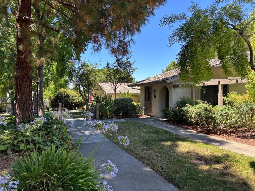 Welcome to a delightful 2-bedroom, 1-bathroom home nestled in a vibrant 55+ community in San Jose. This inviting residence spans 947 sq ft, blending comfort with convenience. The well-equipped kitchen with a brand new dishwasher is perfect for culinary enthusiasts, seamlessly connecting to a light-filled dining area featuring a charming skylight. Enjoy year-round comfort with modern amenities like central air conditioning and ceiling fans, complemented by new carpet that enhances the homes appeal. Immerse yourself in a wealth of community amenities: indulge in the on-site restaurant, perfect your swing at the golf course with pro shop, and unwind in the multiple pool and jacuzzi areas. Stay active with tennis and pickleball courts, scenic walking trails, and a well-equipped fitness center. The community library and bocce court offer additional opportunities for leisure and relaxation. Plus, the included dryer simplifies laundry tasks, making life even easier. Embrace the San Jose lifestyle in this warm and welcoming abode, where comfort meets community!