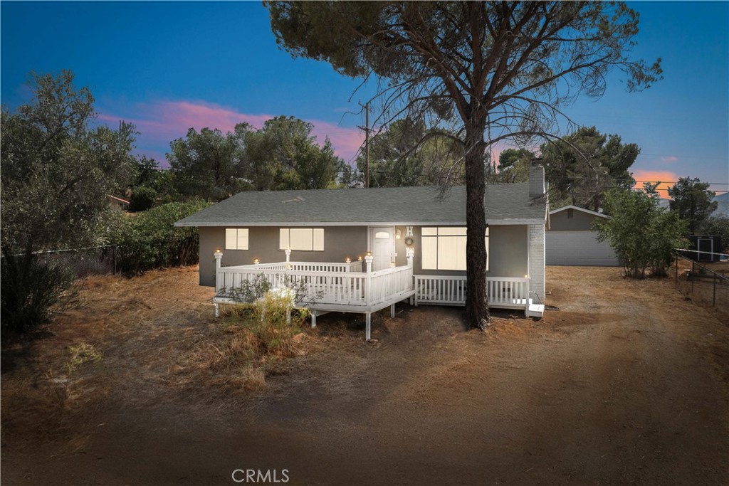 ? This One Will Not Last! ? Perfect as a starter home or an excellent rental investment opportunity, this charming property sits on over half an acre — a blank canvas for your landscaping dreams and creativity! Inside, the home is move-in ready with gorgeous laminate flooring in the common areas, cozy carpet in the bedrooms, and fresh interior paint. The spacious living room features a brick fireplace and ceiling fan, perfect for relaxing or hosting guests. The kitchen boasts beautiful gray cabinets, quartz countertops, and stainless steel appliances, including a microwave, stove, and dishwasher — all included! The upgraded bathroom offers dual sinks, and you'll enjoy the convenience of indoor laundry. Outside, you'll find a covered patio, a detached 2-car garage, and a deck with views overlooking the heart of Quartz Hill. Located just minutes from restaurants, coffee shops, shopping centers, and more — this home combines comfort, convenience, and space to make it your own.