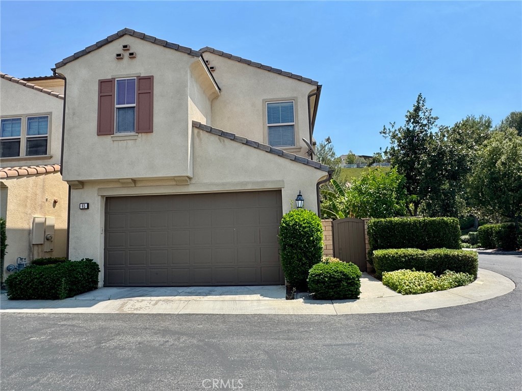 Beautifully upgraded detached home is move in ready and available now! This highly sought after 4 bed + loft floor plan has been freshly painted and has a main level bedroom and bathroom. Other features include open floor plan with spacious kitchen with upgraded cabinets, granite countertops, stainless steel appliances, double oven, refrigerator, gas range and large center island overlooking a dining area and family room with fireplace. The 2nd level consists of a spacious loft, primary bedroom with nicely appointed bathroom with dual sinks, walk-in shower, a soaking tub & walk-in closet. Two secondary bedrooms share a hall bathroom with dual sinks. Enjoy the convenience of upstairs laundry room with washer and dryer included. Exterior areas feature a private paved side-yard and backyard with lush trees and room for outdoor dining. Ample parking spaces on the single loaded street and enjoy the full sized two car garage with direct access. Portola Spring is a master planned community with multiple parks and highly rated schools. The property is located on a quiet street with short walking distance to nearby park, swimming pool & spa, basketball court, playground and outdoor BBQ. Enjoy amazing schools: Portola Springs Elementary, Jeffrey Trail Middle and Portola High (rated 10!) This is the home you have been waiting for! NOTE: there is no fee to apply. Landlord looking for 1 year minimum, excellent credit over 700, income 3x rent, good landlord references and no pets.