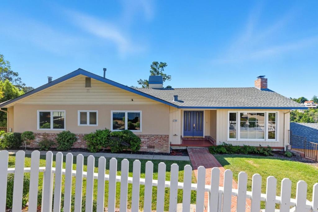 Prepare to be impressed! This beauty has it all! Set behind a charming white picket fence, this light filled view home sits on a large, sunny, prominent lot in prestigious Burlingame Hills! Designed for both comfort & entertaining, it offers an impressive amount of space with 2 stunning family rooms, a huge formal dining room, a dedicated office & a massive workshop. At the heart of the home is the granite Chef's kitchen, seamlessly connected to a vaulted ceiling family room with recessed lighting & its own spacious deck perfect for outdoor dining while taking in the views! The main level also features generous secondary bedrooms & a serene primary suite with 2 closets (including a huge walk-in) and a remodeled spa like bath with 2 sinks. Downstairs, discover a second world of living: a magnificent family room with custom detailing, recessed lighting, & another expansive deck. This level also includes a remodeled full bath, a large office/possible 4th bedroom, a huge laundry room & a massive workshop! 2 zone heating with A/C on the main level! New roof, carpet & interior paint! Large 2 car garage plus ample off street parking! Highly rated Burlingame schools & easy access to Burlingame's vibrant downtown! Truly a rare find in one of the Peninsulas most sought after neighborhoods!