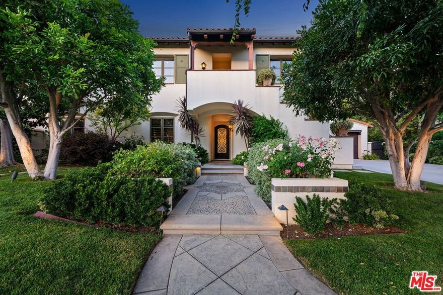 Welcome to 3850 Prado De Las Uvas  an extraordinary Mediterranean estate nestled in one of Southern California's most prestigious guard-gated communities: The Oaks of Calabasas. Celebrated for its exclusivity, security, and resort-like atmosphere, The Oaks offers an elite lifestyle with amenities and privacy reserved for the most discerning homeowners. Privately situated at the end of a tranquil cul-de-sac, this exceptional estate rests on an expansive, over half-acre lot, offering both seclusion and sophistication. With approximately 6,480 square feet of living space, the home features 5 spacious ensuite bedrooms and a highly adaptable floor plan designed for modern living. Upon entry, you're welcomed by warm architectural detail, elegant archways, and curated finishes that reflect timeless Mediterranean charm. Warm wood floors span much of the main level, complementing the home's rich textures and tones. Built by the renowned Luxury Lang builders, the residence is crafted with enduring quality and timeless appeal. At the heart of the home is the great room, featuring striking beam ceiling detail, custom fireplace and an effortless flow from the gourmet chef's kitchen  complete with top-of-the-line stainless steel appliances, a dramatic oversized island, custom cabinetry, double ovens, and an inviting breakfast nook.Upstairs, the primary suite is a private sanctuary, accessed through a quiet retreat foyer and highlighted by a warming fireplace and a covered veranda overlooking the lush grounds. The spa-inspired primary bath features an oversized shower, soaking tub, designer window treatments, and exquisite custom lighting.Additional amenities include a spacious loft ideal for a secondary family room or office, a state-of-the-art home theater, game room and gym, The resort-style backyard is designed for grand entertaining and peaceful relaxation alike  with a sparkling pool and spa, built-in BBQ, covered patio lounge, and a full-size sport court, all surrounded by mature landscaping and manicured lawns. As a resident of The Oaks of Calabasas, you gain exclusive access to premier amenities, including a private clubhouse, tennis and pickleball courts, basketball, a resort-style pool, gym, and scenic community park  all within a 24-hour guard-gated setting that offers peace of mind and privacy. All of this, just minutes from Malibu's beaches, upscale shopping and dining at The Commons, and within the award-winning Las Virgenes School District.