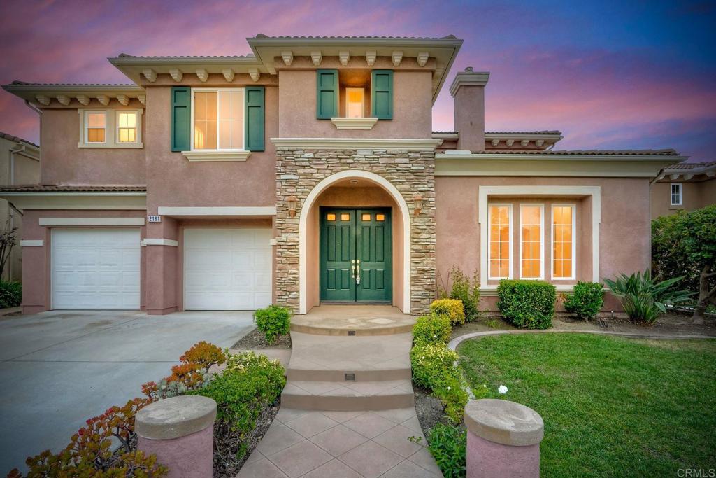 Perched above Rancho Dorado with sweeping mountain and ocean views, 2161, This large 4300Sqft executive home is a rare gem offering luxury living on a sprawling 0.34-acre lot. With 4+bedrooms, 4-baths and a flexible floor plan ideas with a main-level bedroom, an oversized loft easily converted to a fifth bedroom, and multiple fireplaces throughout. The designer primary suite includes a dual-sided fireplace, private balcony, spa-like bath, and walk-in closet. Entertain in style from the open kitchen or step outside to enjoy a serene backyard while taking in breathtaking sunsets over Palomar Mountain and the Pacific. Additional highlights include a 3-car tandem garage and close proximity to top-rated schools, parks, trails, and shopping. This exceptional home blends space, elegance, and comfort in one of San Marcos’ most desirable communities.
