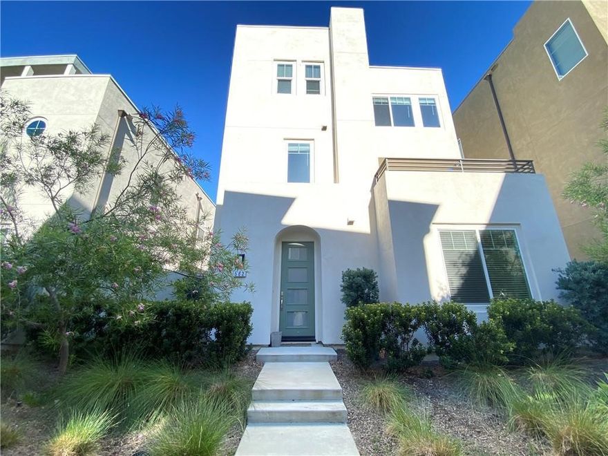 Welcome to this stunning 4-bedroom, 3-bathroom detached home located in the sought-after Cadence Park in Great Park Irvine. This spacious residence offers over 2,154 sq.ft of open-concept living, with a highly desirable main-level bedroom and full bath – perfect for guests or multigenerational living.The chef’s kitchen features a large island, quartz countertops, full-height backsplash, stainless steel appliances, and upgraded cabinetry, flowing seamlessly into a bright and airy great room with expansive windows and recessed lighting. Upstairs, you'll find a luxurious primary suite with a walk-in closet and spa-inspired bathroom, along with two additional bedrooms, a full hallway bath, and a convenient upstairs laundry room. Enjoy private outdoor space ideal for entertaining, a 2-car attached garage, and access to resort-style amenities including multiple pools, parks, sports courts, trails, and community events – all within one of Irvine’s most dynamic master-planned neighborhoods.