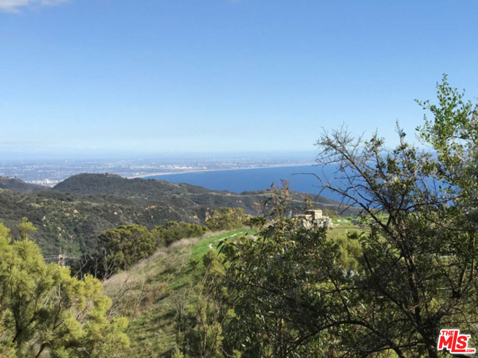 Discover the rare opportunity to own a piece of Malibu's natural beauty in this secluded 2.5-acre parcel, nestled in a private enclave of custom homes. This unique property offers the perfect blend of privacy, space, and a rural country atmosphere just minutes from the coast yet a world away in serenity. Located at an impressive 2,200 feet above sea level, the property boasts a stunning park-like environment with sweeping views and abundant natural vegetation. Native flora such as Redshank, Ceanothus, Toyon, Laurel Sumac, and Holly-Leaf Cherry fill the landscape, creating a vibrant and peaceful setting for your future dream home. A geology report and percolation tests have been successfully completed, and an LA County-approved septic waste disposal design is on file. A site plan has also been professionally prepared by a licensed surveyor, ensuring that many of the preliminary steps toward development are in place. Originally purchased by the seller with the vision of building their dream home, this remarkable property now awaits a new owner to bring their own vision to life. Don't miss this chance to build in one of Malibu's most tranquil and naturally beautiful areas.