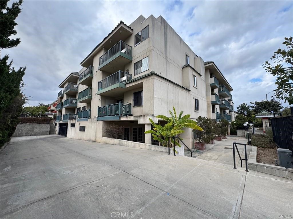 Welcome to this beautiful senior condo in the sought-after Golden Age Villas, centrally located in Monterey Park. Situated on the second floor, this corner unit offers the perfect blend of comfort and style with 2 spacious bedrooms, an open floor plan, and a private patio. The upgraded kitchen features elegant wood cabinetry and sleek granite countertops, combining both functionality and luxury. Both bedrooms and bathrooms are generously sized, with the bathrooms featuring convenient stall showers. Additional highlights include the desirable end-unit location, remodeled kitchen, wood flooring, in unit laundry and a cozy patio. Enjoy the added perks of low HOA fees, a serene koi pond, a rec room, fitness center, and much more!